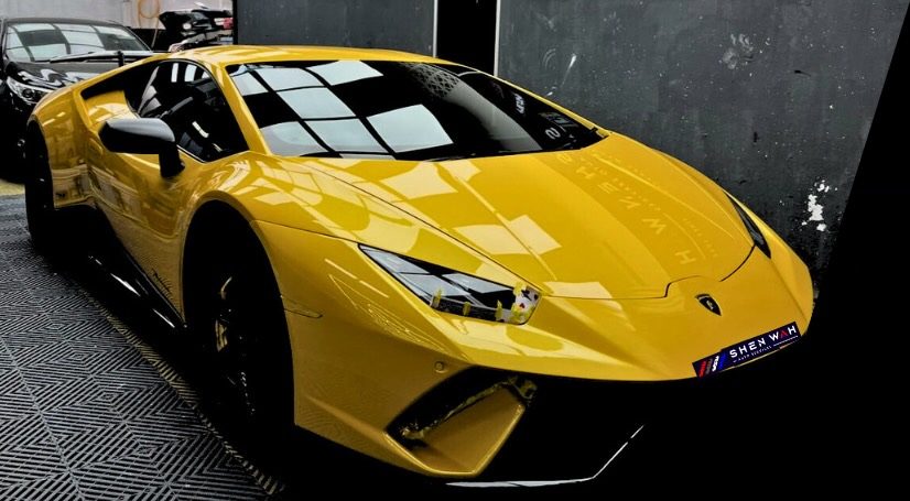 Yellow Lamborghini Huracán at the Shen Wah workshop